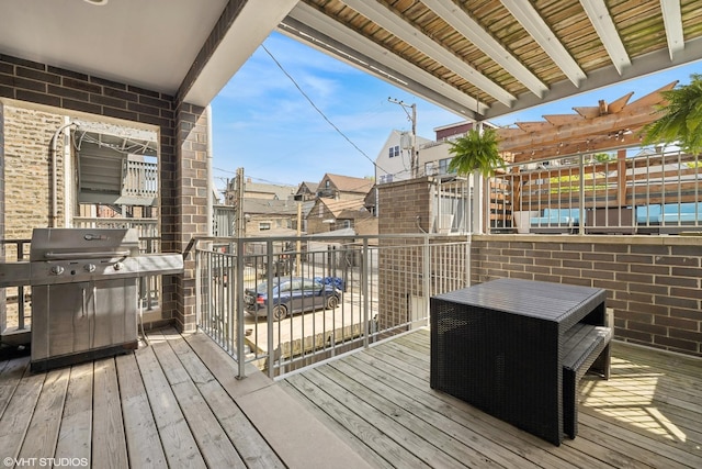 wooden terrace featuring area for grilling