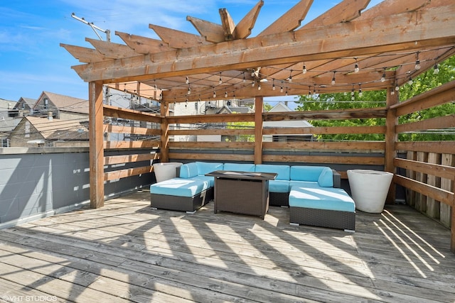 wooden terrace with an outdoor hangout area and a pergola