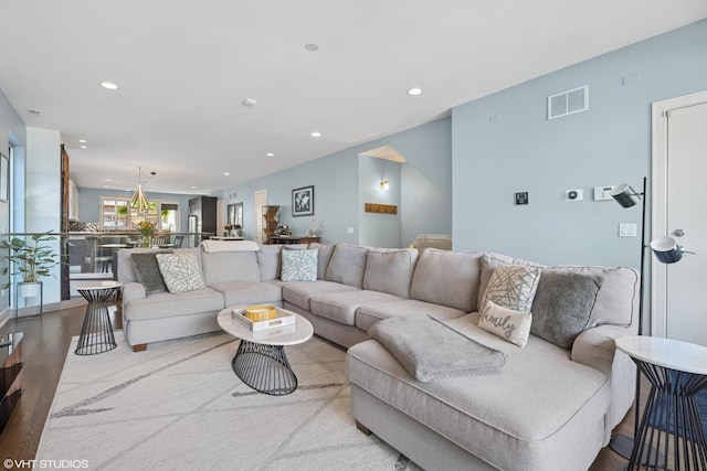living room featuring recessed lighting and wood finished floors