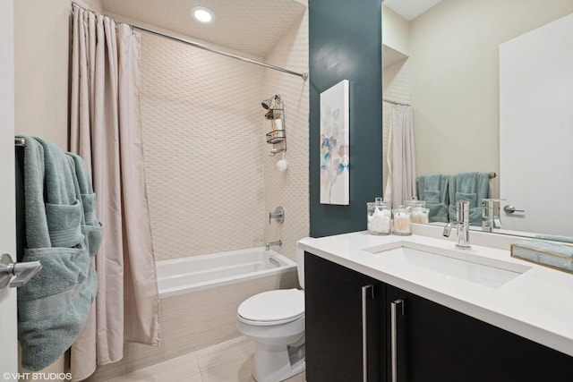 bathroom featuring shower / bath combo with shower curtain, toilet, and vanity