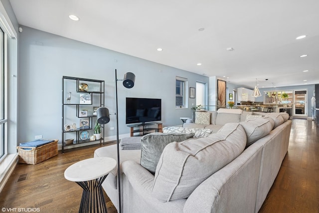 living room with wood finished floors and recessed lighting