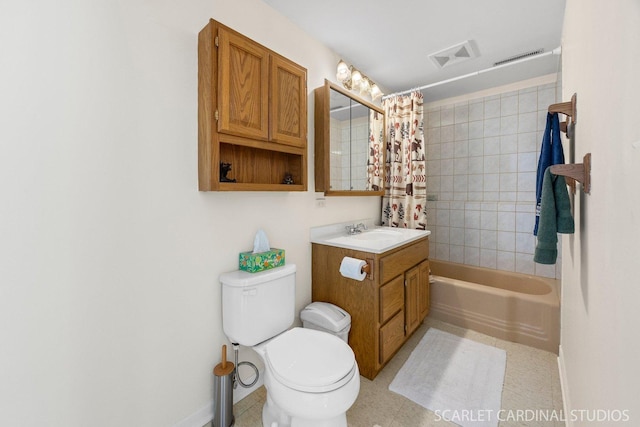 bathroom featuring toilet, vanity, and shower / tub combo