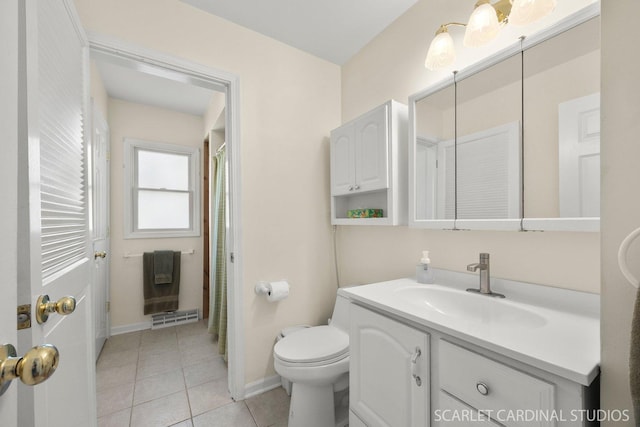 bathroom with toilet, vanity, tile patterned flooring, baseboards, and curtained shower