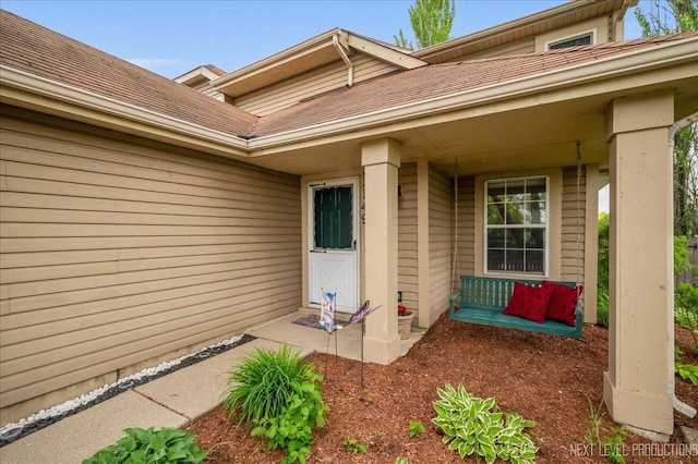 property entrance featuring covered porch