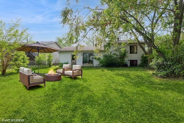 18111 Orleans Dr, Hazel Crest, IL 60429 - back of house with a yard and an outdoor living space with a fire pit