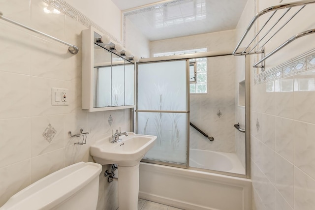 1021 S Blvd, Evanston, IL 60202 - bathroom featuring bath / shower combo with glass door and tile walls