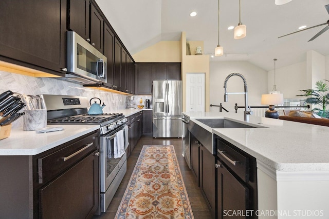 4404 Monroe Ct, Naperville, IL 60564 - kitchen with appliances with stainless steel finishes, a sink, vaulted ceiling, backsplash, and an island with sink