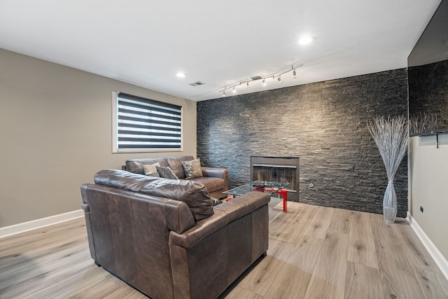 8909 S 85th Ct, Hickory Hills, IL 60457 - living area featuring light wood finished floors, a fireplace, baseboards, and recessed lighting