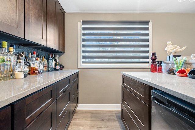 8909 S 85th Ct, Hickory Hills, IL 60457 - indoor dry bar with dishwashing machine, baseboards, and light wood-style flooring