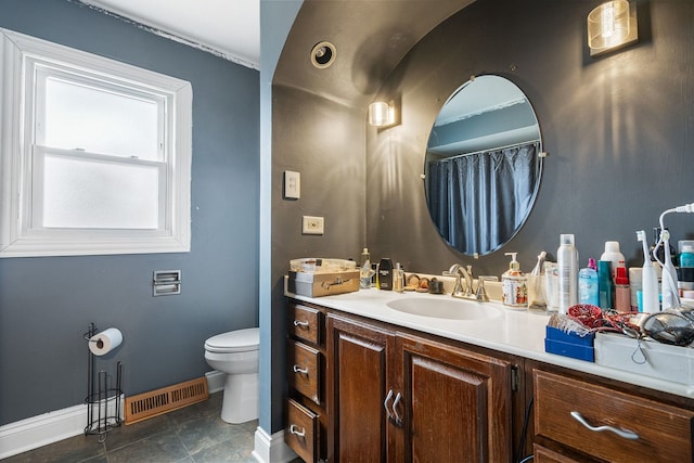 8909 S 85th Ct, Hickory Hills, IL 60457 - bathroom featuring baseboards, vanity, and toilet