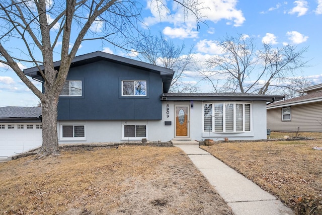 8909 S 85th Ct, Hickory Hills, IL 60457 - split level home featuring stucco siding and an attached garage