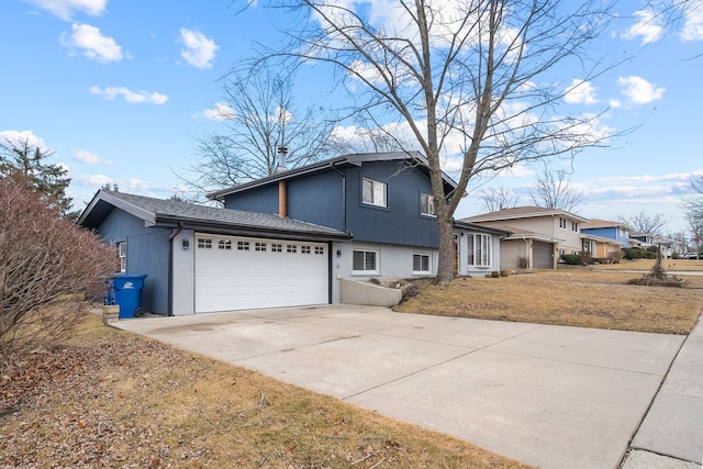 8909 S 85th Ct, Hickory Hills, IL 60457 - view of front of property with a garage, driveway, and stucco siding