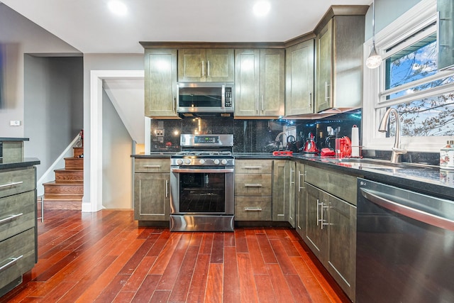 8909 S 85th Ct, Hickory Hills, IL 60457 - kitchen with appliances with stainless steel finishes, a sink, decorative backsplash, dark wood finished floors, and recessed lighting
