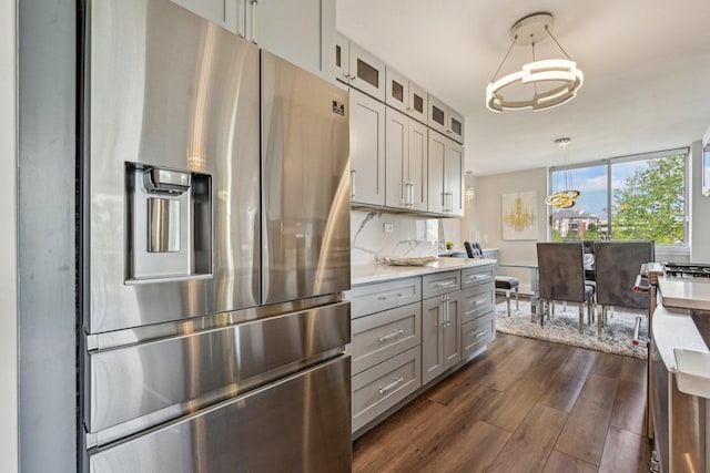 40 N Tower Rd Unit 3G, Oak Brook, IL 60523 - kitchen featuring stainless steel refrigerator with ice dispenser, gray cabinets, dark wood-type flooring, light countertops, and glass insert cabinets
