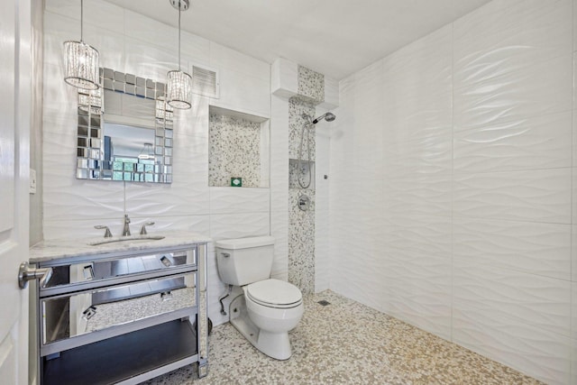 40 N Tower Rd Unit 3G, Oak Brook, IL 60523 - full bathroom with tile walls, toilet, tiled shower, and vanity