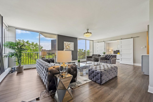 40 N Tower Rd Unit 3G, Oak Brook, IL 60523 - living area featuring a barn door, dark wood finished floors, and expansive windows