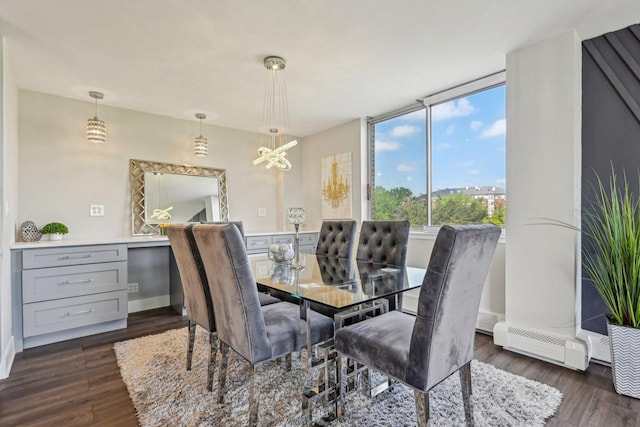 40 N Tower Rd Unit 3G, Oak Brook, IL 60523 - dining room featuring dark wood-style floors, a chandelier, baseboards, and a baseboard heating unit