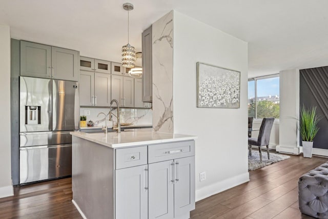 40 N Tower Rd Unit 3G, Oak Brook, IL 60523 - kitchen featuring stainless steel fridge with ice dispenser, dark wood-style floors, a chandelier, and light countertops