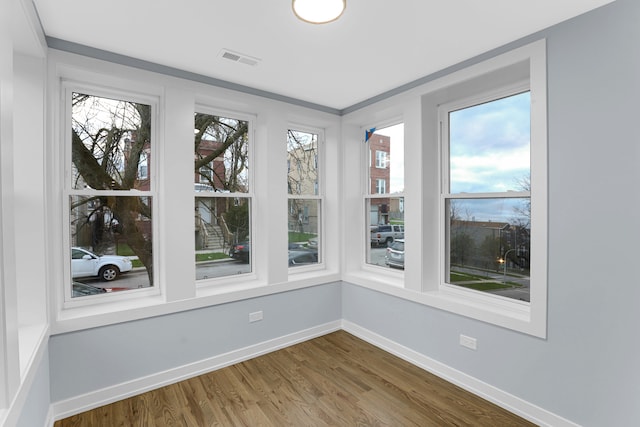 1315 S Kolin Ave, Chicago, IL 60623 - unfurnished sunroom featuring wood finished floors and baseboards