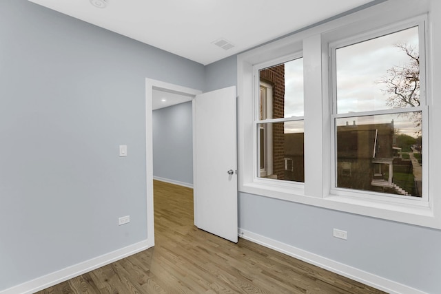 1315 S Kolin Ave, Chicago, IL 60623 - unfurnished room featuring baseboards and wood finished floors