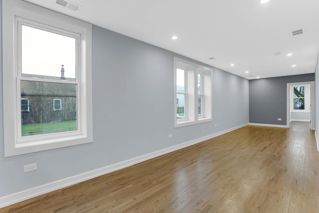 1315 S Kolin Ave, Chicago, IL 60623 - empty room with wood finished floors, baseboards, and recessed lighting