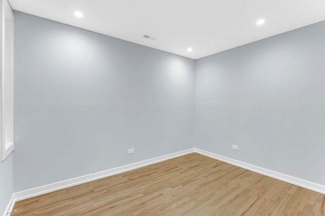 1315 S Kolin Ave, Chicago, IL 60623 - unfurnished room with light wood finished floors, baseboards, and recessed lighting