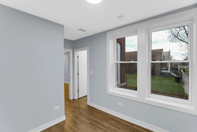 1315 S Kolin Ave, Chicago, IL 60623 - spare room with baseboards and wood finished floors