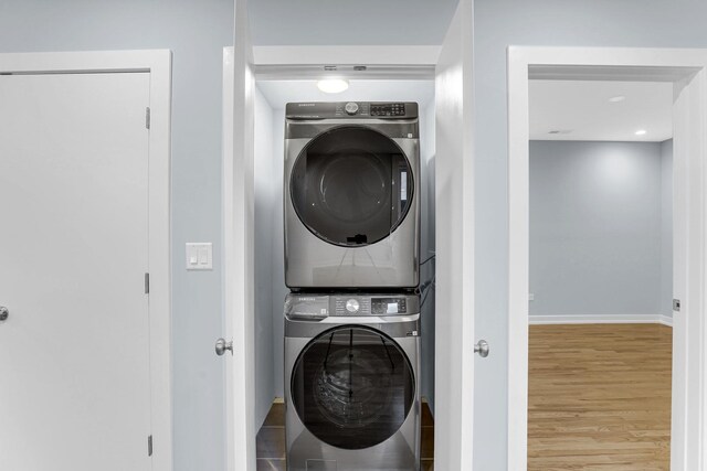 1315 S Kolin Ave, Chicago, IL 60623 - laundry room featuring estacked washer and dryer, wood finished floors, baseboards, and recessed lighting