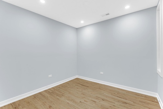 1315 S Kolin Ave, Chicago, IL 60623 - unfurnished room with light wood finished floors, baseboards, and recessed lighting