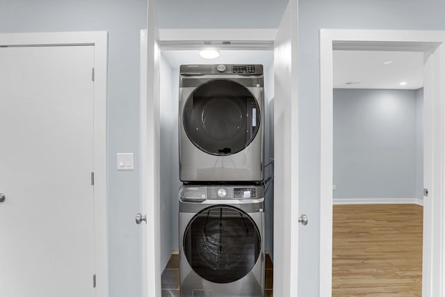 1315 S Kolin Ave, Chicago, IL 60623 - laundry room with stacked washer and clothes dryer, wood finished floors, baseboards, and recessed lighting