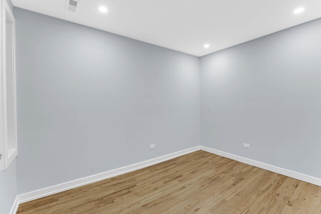 1315 S Kolin Ave, Chicago, IL 60623 - empty room with light wood-type flooring, baseboards, and recessed lighting