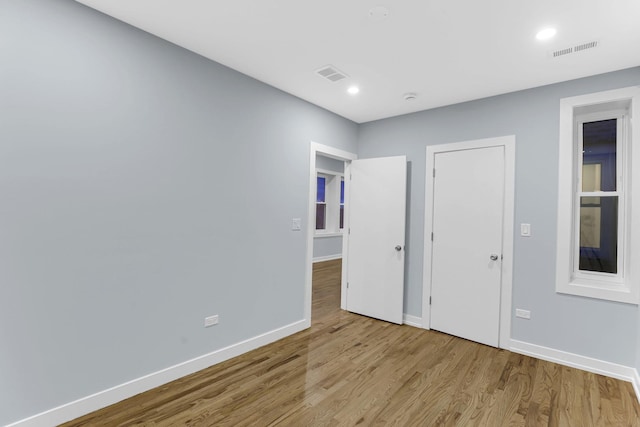 1315 S Kolin Ave, Chicago, IL 60623 - empty room with baseboards, wood finished floors, and recessed lighting
