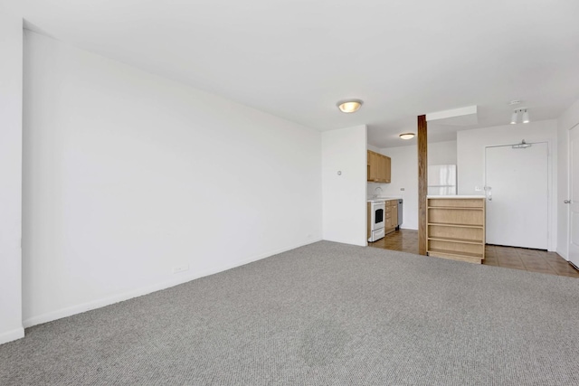 1850 N Clark St Unit 1510, Chicago, IL 60614 - unfurnished living room featuring carpet flooring and baseboards