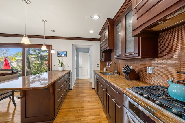 15322 Woodmar Dr, Orland Park, IL 60462 - kitchen with a sink, a kitchen bar, a peninsula, glass insert cabinets, and light stone countertops