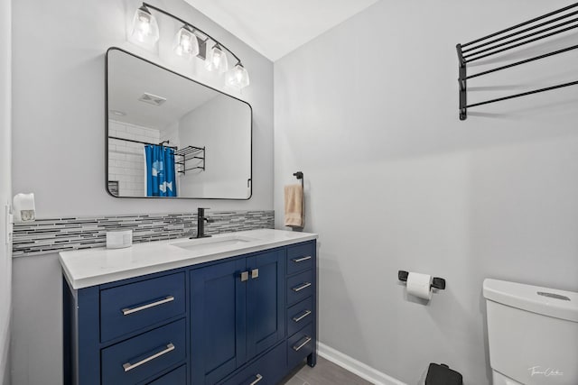 15322 Woodmar Dr, Orland Park, IL 60462 - full bath featuring tasteful backsplash, toilet, baseboards, and vanity
