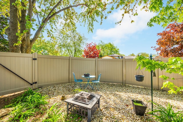 15322 Woodmar Dr, Orland Park, IL 60462 - fenced backyard featuring a gate and a fire pit
