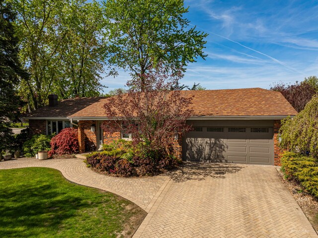 15322 Woodmar Dr, Orland Park, IL 60462 - single story home featuring brick siding, decorative driveway, an attached garage, and a chimney