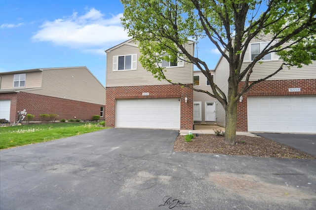 16560 Willow Walk Dr, Lockport, IL 60441 - view of front of property featuring brick siding, asphalt driveway, a garage, and a front lawn