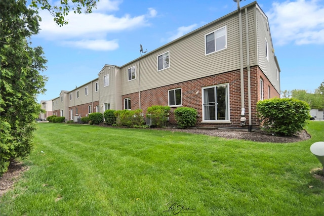 16560 Willow Walk Dr, Lockport, IL 60441 - back of property with brick siding and a yard