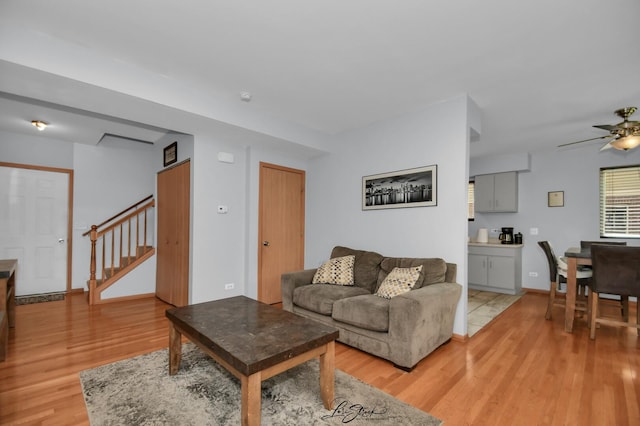 16560 Willow Walk Dr, Lockport, IL 60441 - living area featuring light wood-style floors, stairs, ceiling fan, and baseboards