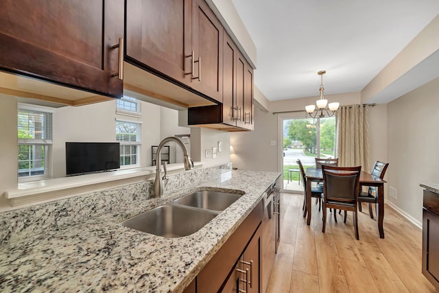 8530 Westberry Ln, Tinley Park, IL 60487 - kitchen with a sink, light wood-type flooring, a chandelier, and healthy amount of natural light