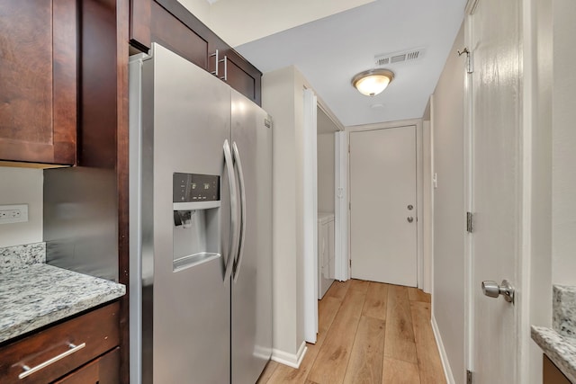 8530 Westberry Ln, Tinley Park, IL 60487 - kitchen featuring stainless steel refrigerator with ice dispenser, light wood-type flooring, washer / clothes dryer, baseboards, and light stone countertops