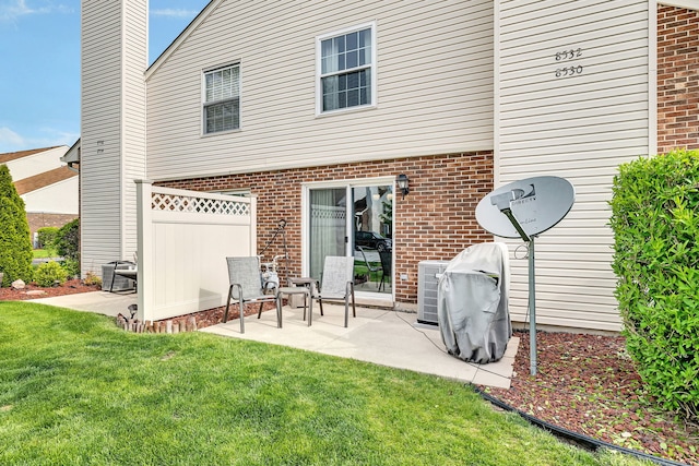 8530 Westberry Ln, Tinley Park, IL 60487 - back of house featuring brick siding, a patio, and a chimney