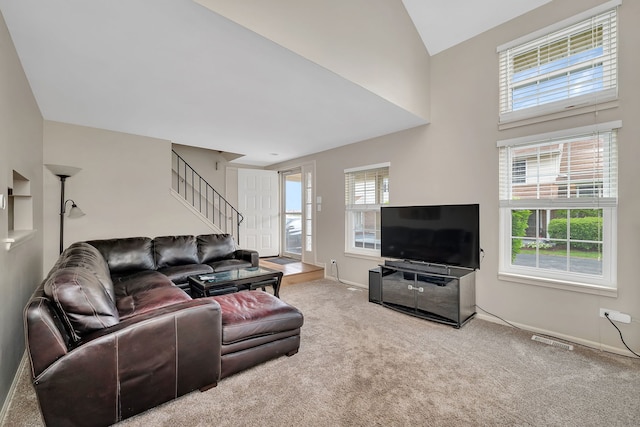 8530 Westberry Ln, Tinley Park, IL 60487 - carpeted living area with stairs, baseboards, and lofted ceiling