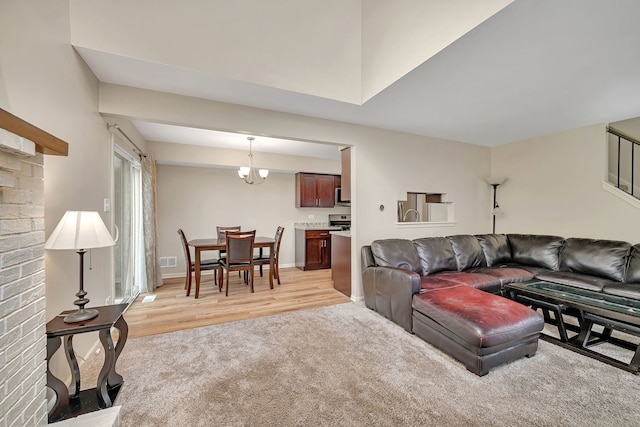 8530 Westberry Ln, Tinley Park, IL 60487 - living area featuring light wood-type flooring, light colored carpet, and baseboards