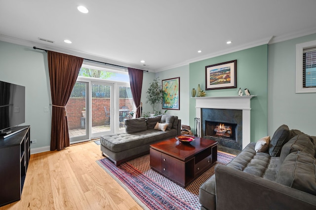 6036 N Damen Ave Unit 1S, Chicago, IL 60659 - living room with ornamental molding, light wood-style floors, a fireplace, recessed lighting, and baseboards