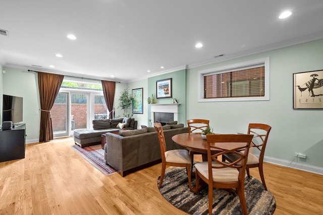 6036 N Damen Ave Unit 1S, Chicago, IL 60659 - living area featuring ornamental molding, baseboards, recessed lighting, a fireplace, and light wood-type flooring