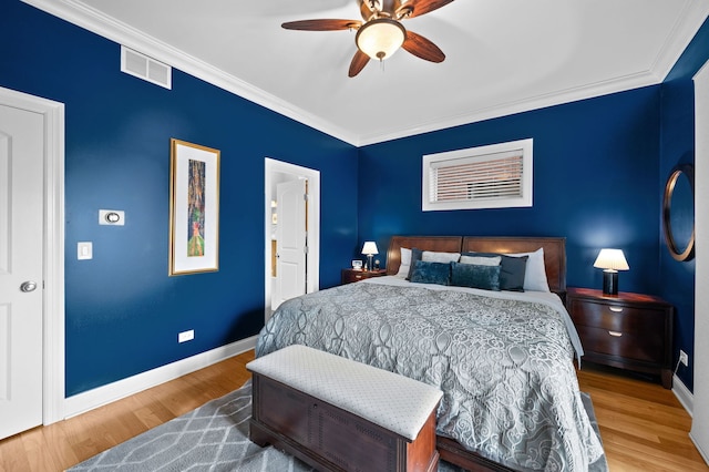 6036 N Damen Ave Unit 1S, Chicago, IL 60659 - bedroom with ornamental molding, baseboards, wood finished floors, and a ceiling fan