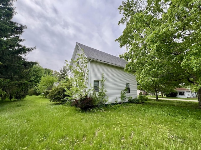 866 E Center St, Paxton, IL 60957 - view of home's exterior with a shingled roof