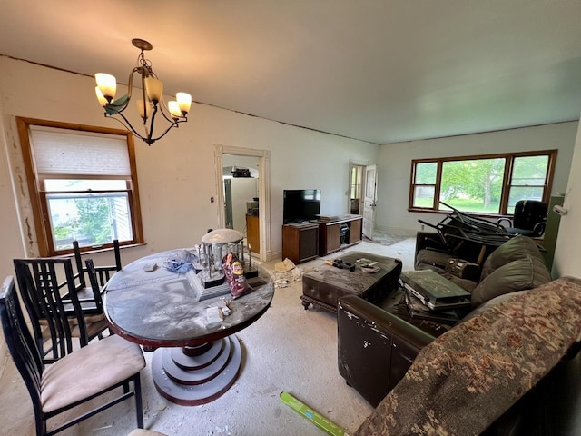 866 E Center St, Paxton, IL 60957 - living room featuring a chandelier and carpet flooring